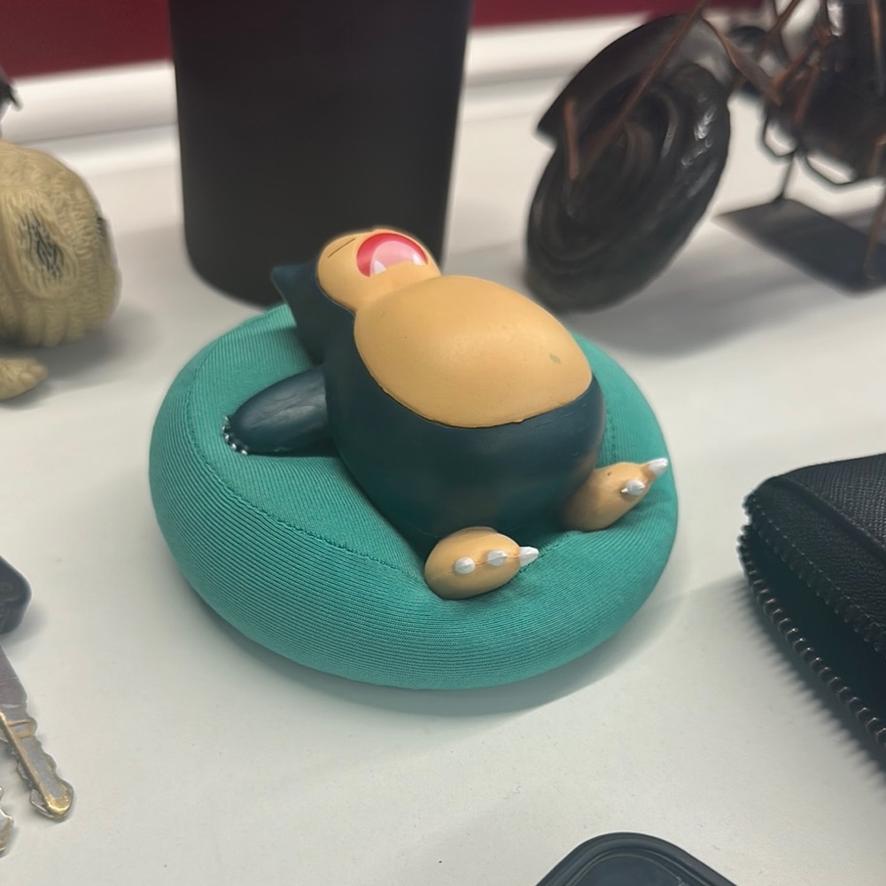 Snorlax Figure on Teal Cushion